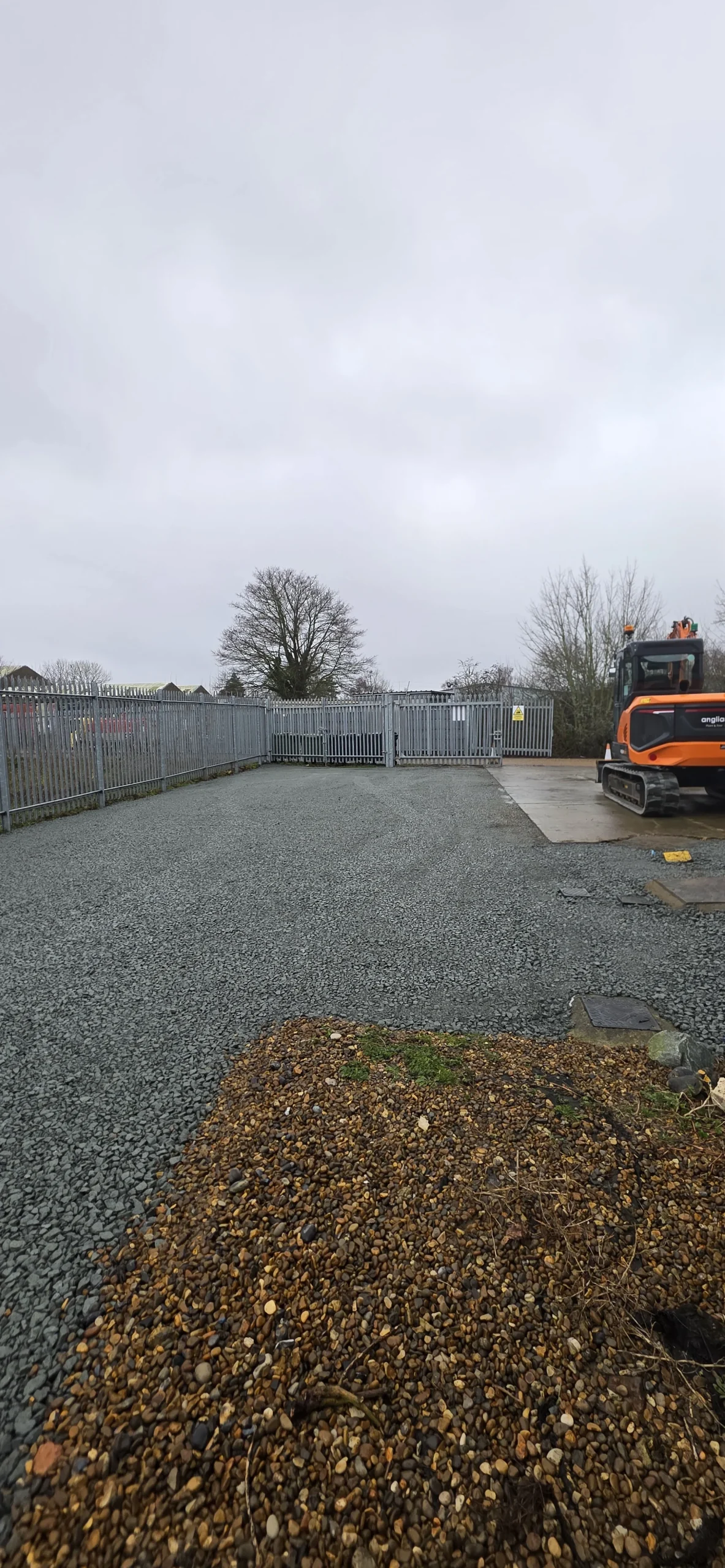 Type 1 aggregate sub-base prepared across a secure commercial yard