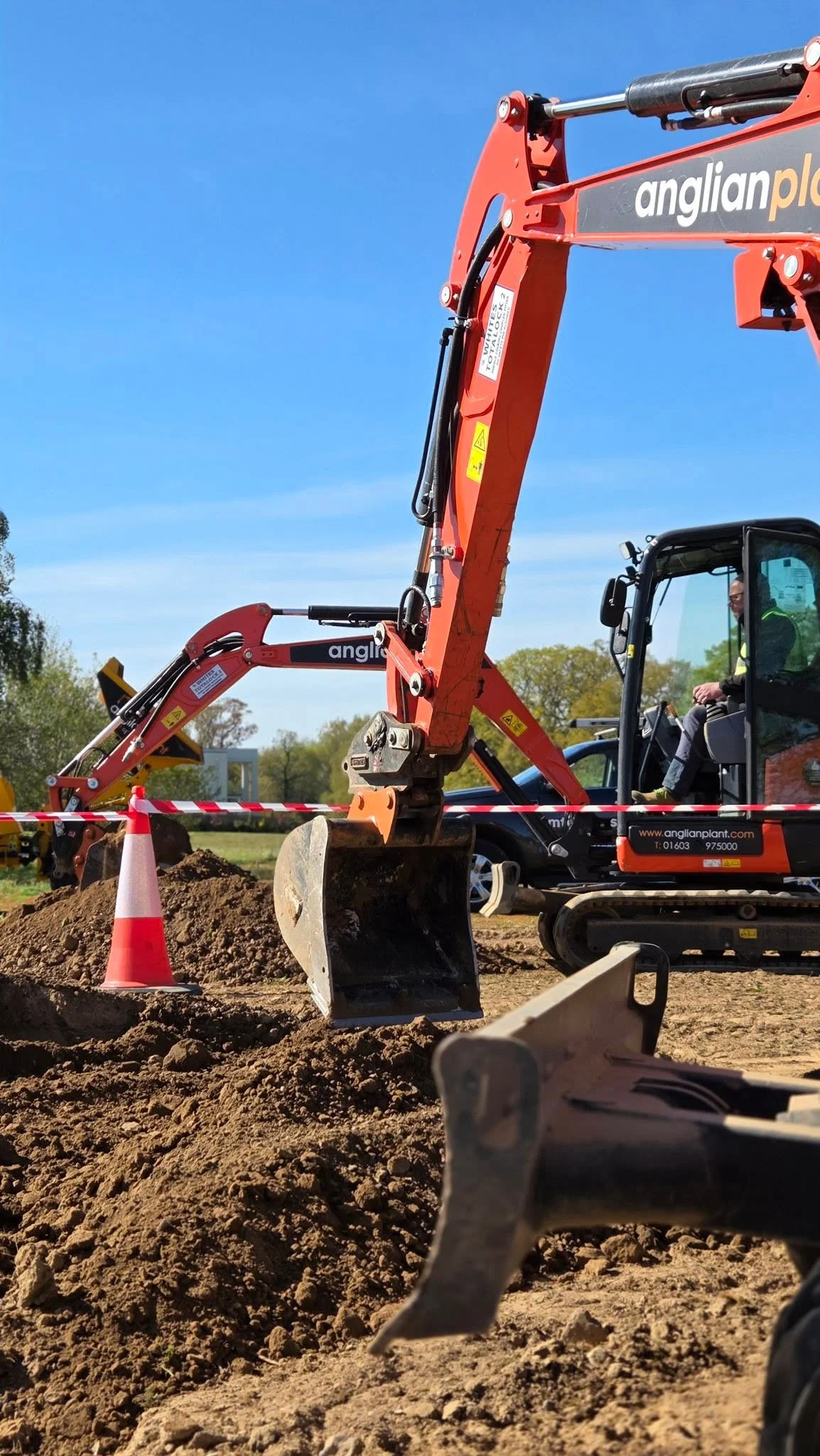 Excavator operator taking part in the Trench Wars charity digger challenge